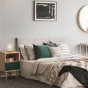 Lampe Ottawa allumée sur une table de chevet, avec un décor minimaliste de chambre. Disponible sur Dakar Sénégal