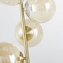 Lampadaire doré avec globes en verre ambré, design moderne à Dakar, Sénégal.