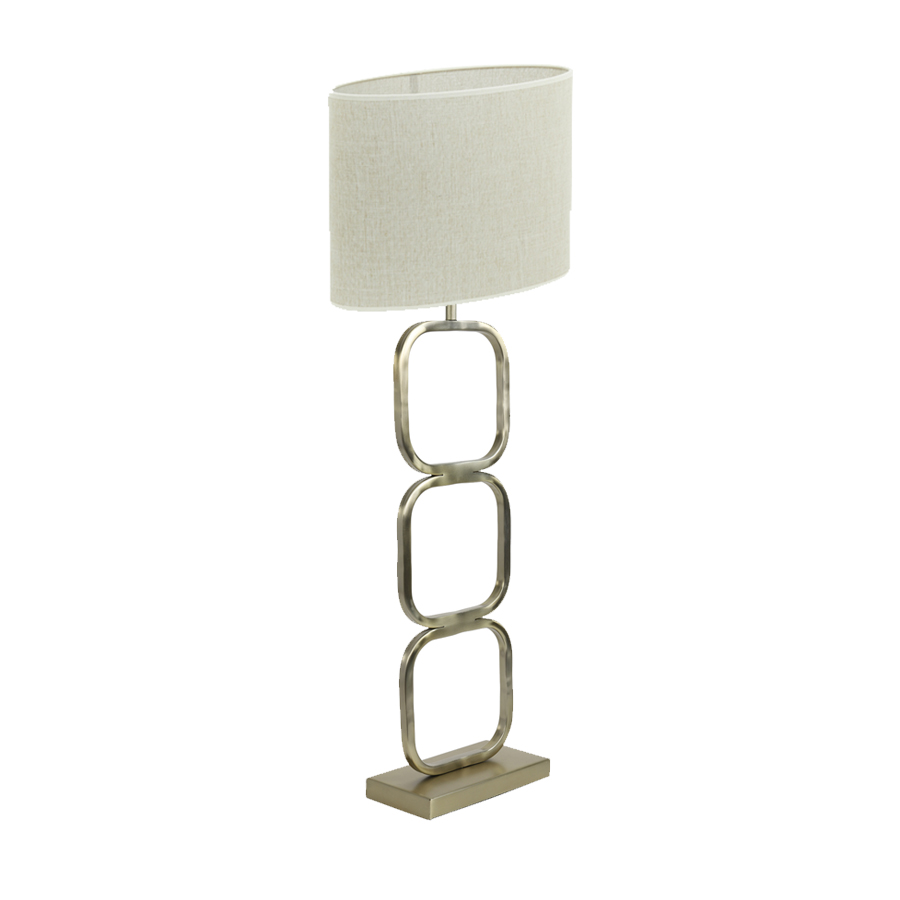 Lampe à poser Lutika en métal doré avec abat-jour en tissu beige, vue générale. Disponible sur Dakar, Sénégal