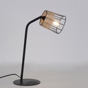 Lampe à poser Indah en métal noir et rotin naturel, sur un bureau avec des plantes, Dakar, Sénégal
