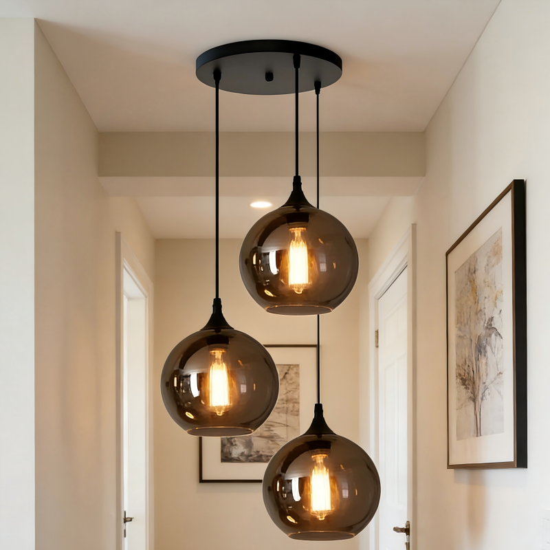 Lustre Frank 3 lampes en metal noir et verre forme de bouteille fumé