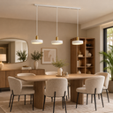 Salle à manger scandinave aux suspensions dorées.png